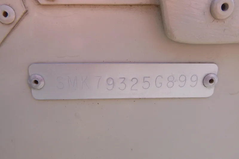 Slide: The Image of 1999 Smoker Craft 150 Stinger boat identification plate with serial number SMK79325G899. - 17