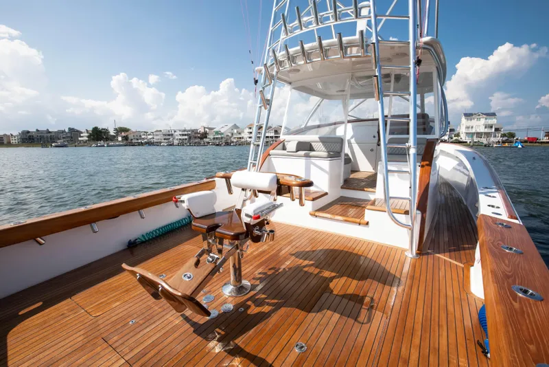 Slide: The Image of 2026 Release Boatworks 46 Walkaround with teak deck, fishing chair, and ocean view. - 4