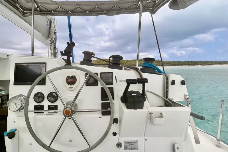Slide: The Image of Helm of 2018 Fountaine Pajot Lucia 40 catamaran with ocean view. - 10