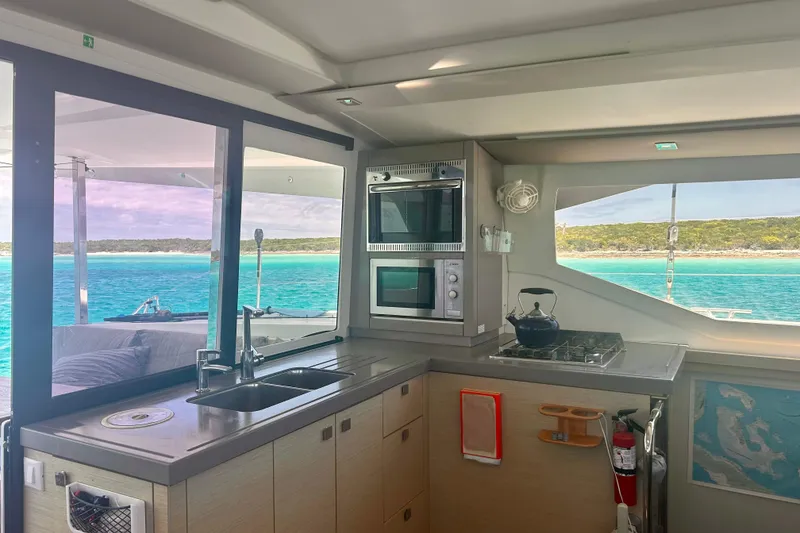 Slide: The Image of Interior of 2018 Fountaine Pajot Lucia 40 yacht with modern kitchen and ocean view. - 13