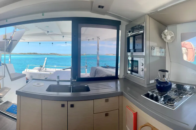 Slide: The Image of Interior of 2018 Fountaine Pajot Lucia 40 catamaran with ocean view through kitchen window. - 15