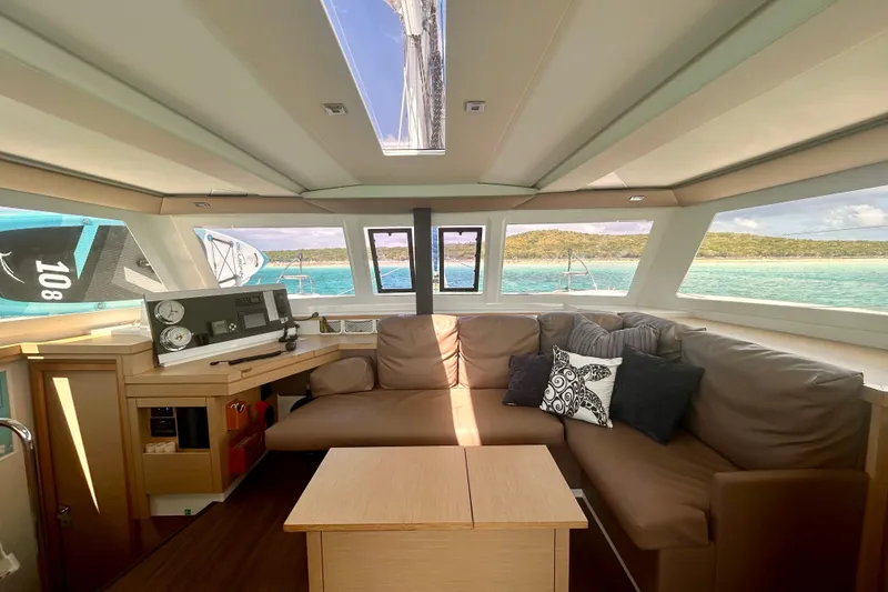 Slide: The Image of Interior of 2018 Fountaine Pajot Lucia 40 catamaran with comfortable seating and scenic ocean view. - 17