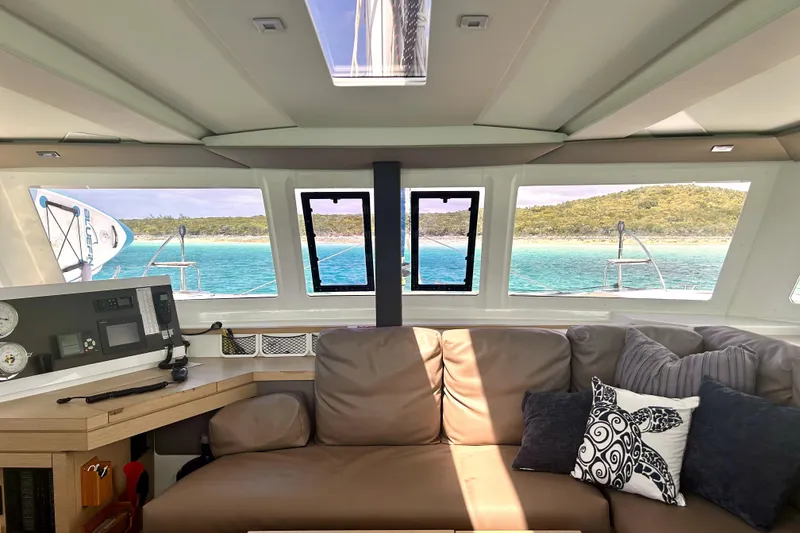 Slide: The Image of Interior view of 2018 Fountaine Pajot Lucia 40 catamaran with ocean and island scenery. - 18