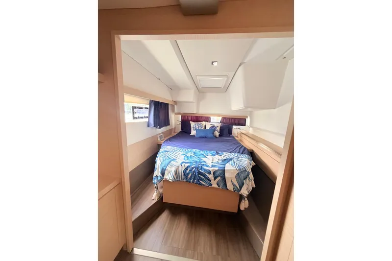 Slide: The Image of Cozy cabin interior of 2018 Fountaine Pajot Lucia 40 catamaran with bed and window. - 22