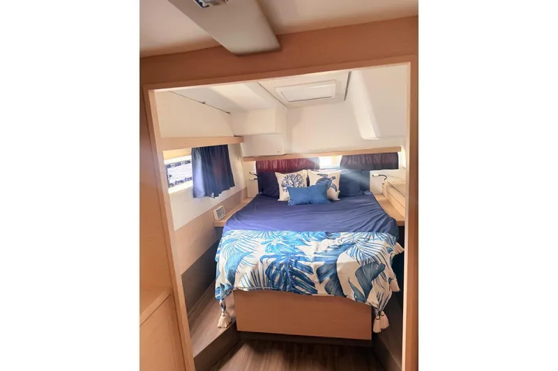 Slide: The Image of Cozy cabin interior of 2018 Fountaine Pajot Lucia 40 with nautical-themed bedding. - 23