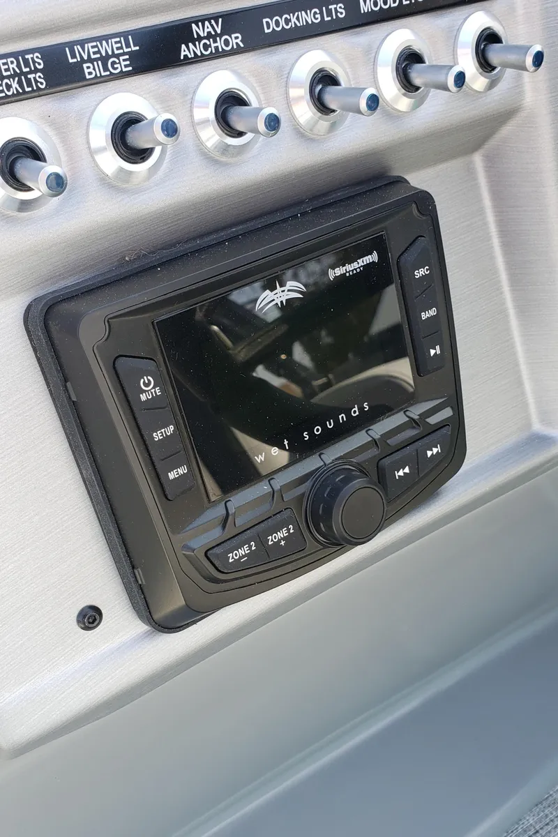 Slide: The Image of Dashboard of a 2023 South Bay S224RS25 boat with controls. - 11
