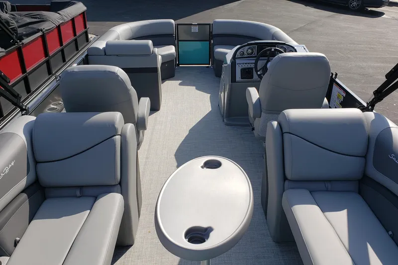 Slide: The Image of Interior of a 2023 South Bay S224RS25 pontoon boat with gray seating. - 13