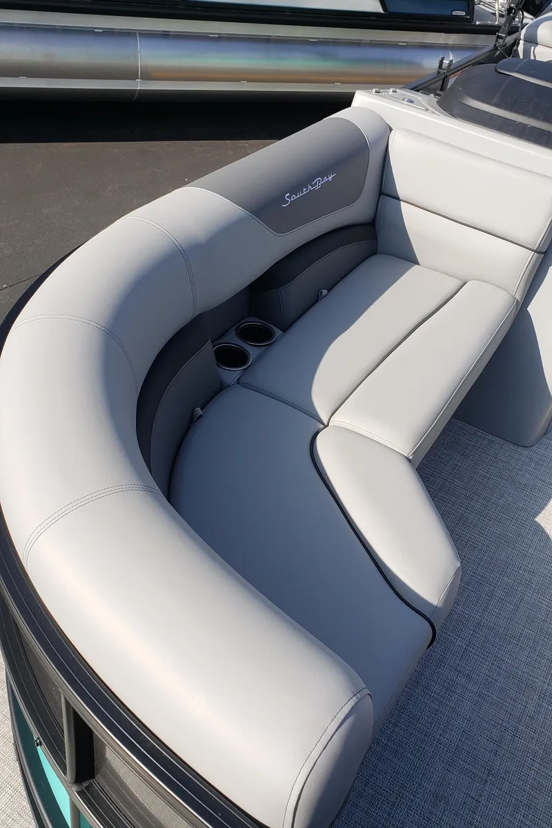 Slide: The Image of Luxurious seating on a 2023 South Bay S224RS25 pontoon boat. - 4