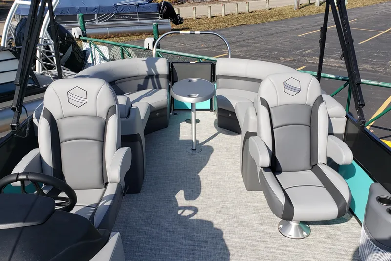 Slide: The Image of Interior of a 2023 South Bay S224RS25 pontoon boat with gray seating. - 5