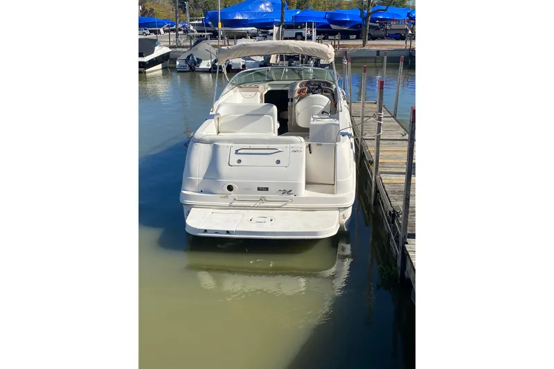 Slide: The Image of 2001 Sea Ray Sundancer 260 docked at marina, rear view. - 3