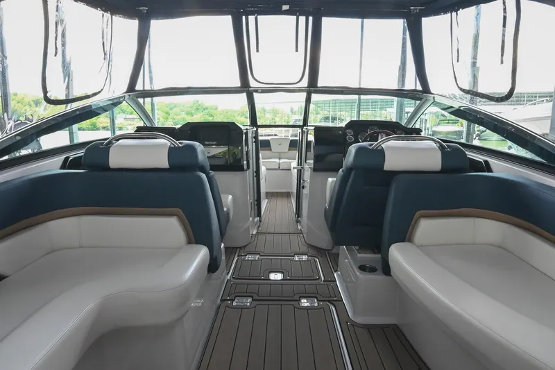 Slide: The Image of Interior of 2014 Four Winns H290 boat with luxurious seating and modern dashboard. - 13
