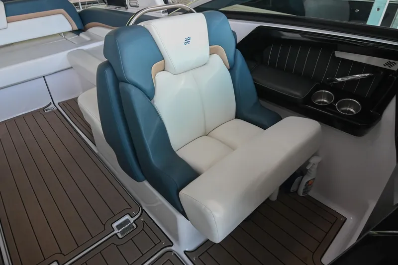Slide: The Image of Luxury seating on 2014 Four Winns H290 boat with elegant design and cup holders. - 17