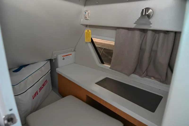 Slide: The Image of Interior cabin of 2014 Four Winns H290 boat with life jackets and window. - 24