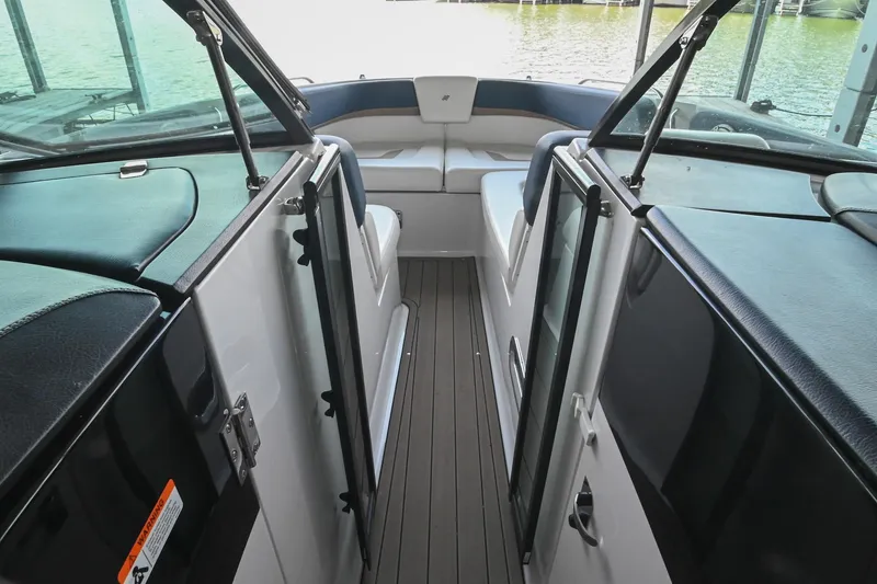 Slide: The Image of 2014 Four Winns H290 boat interior with seating and open deck view. - 25