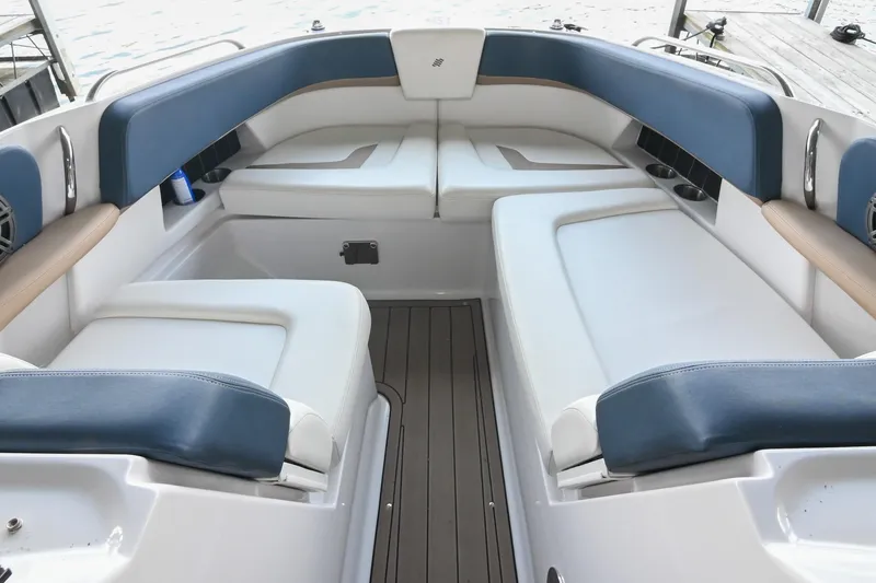 Slide: The Image of Interior seating of 2014 Four Winns H290 boat with blue and white upholstery. - 26