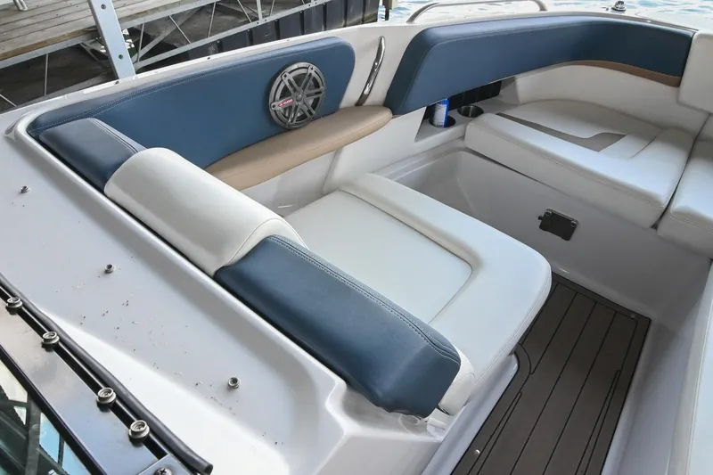 Slide: The Image of Interior seating of 2014 Four Winns H290 boat with blue and white upholstery. - 27