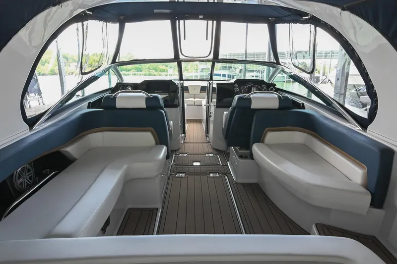Slide: The Image of Interior of 2014 Four Winns H290 boat with luxurious seating and modern dashboard. - 6
