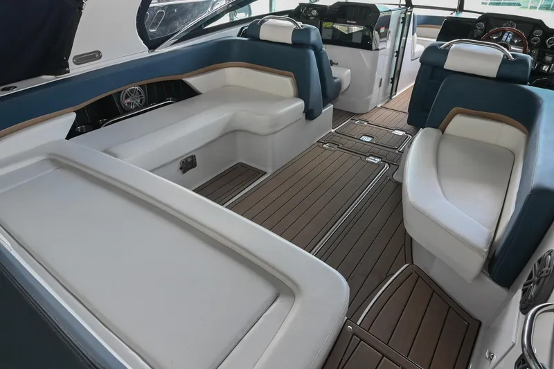 Slide: The Image of Luxurious interior of 2014 Four Winns H290 boat with elegant seating and wood flooring. - 7