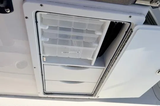Slide: The Image of Storage compartment on 2026 Sea Hunt Gamefish 27 Forward Seating boat. - 23