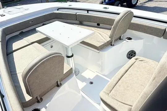 Slide: The Image of 2026 Sea Hunt Gamefish 27 Forward Seating with cushioned seats and table in the bow area. - 25