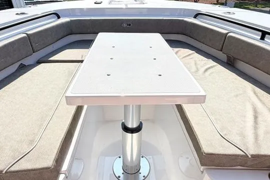 Slide: The Image of 2026 Sea Hunt Gamefish 27 Forward Seating with table and cushioned benches. - 26