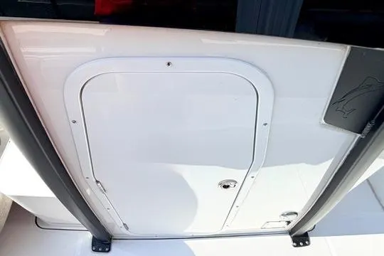 Slide: The Image of 2026 Sea Hunt Gamefish 27 Forward Seating boat hatch, white exterior detail. - 33