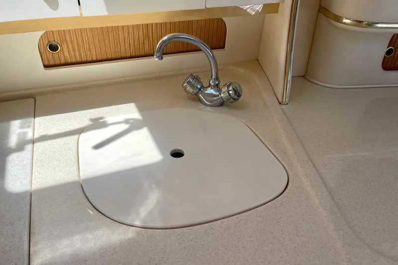 Slide: The Image of Boat kitchen sink with faucet on a 2000 Sea Ray Sundancer 310 yacht. - 20