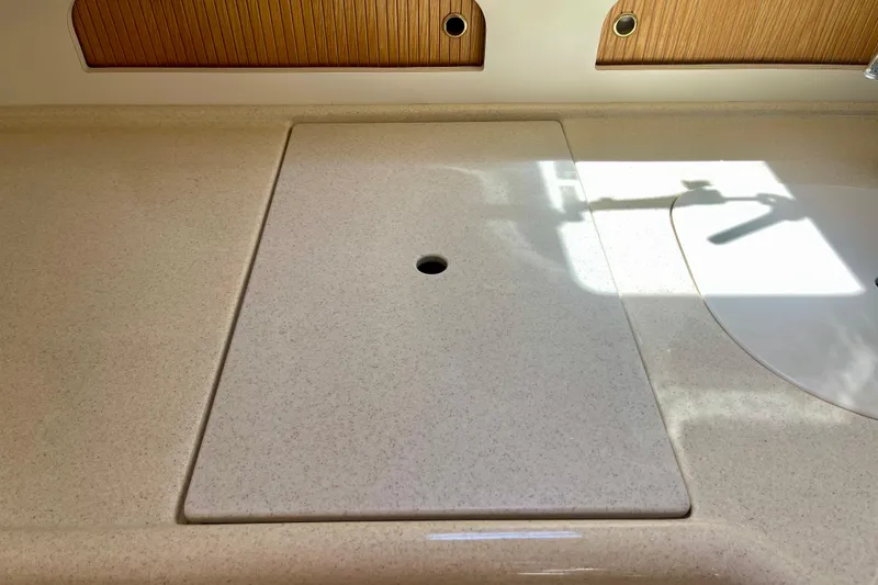 Slide: The Image of Countertop on 2000 Sea Ray Sundancer 310 boat, featuring a sleek, minimalist design. - 22