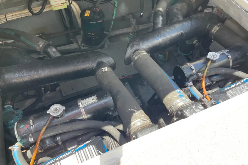 Slide: The Image of Engine compartment of a 2000 Sea Ray Sundancer 310 boat, showcasing mechanical components. - 29