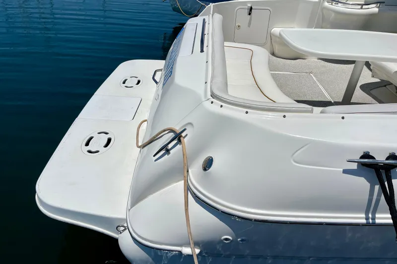 Slide: The Image of 2000 Sea Ray Sundancer 310 boat with spacious deck and seating area. - 8