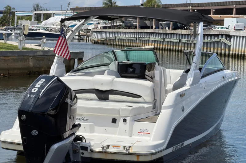 Slide: The Image of 2023 Four Winns HD5 OB boat docked with Mercury 250 V8 engine. - 13