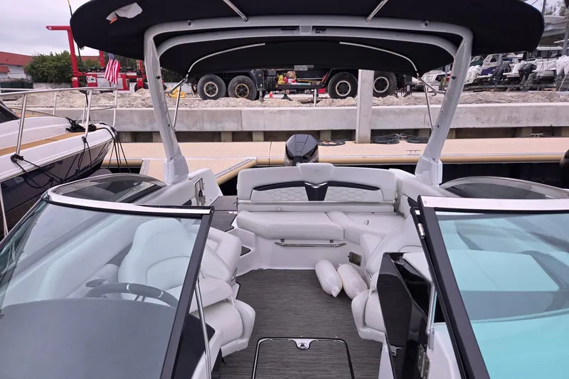 Slide: The Image of 2023 Four Winns HD5 OB boat interior with white seating and modern design. - 4
