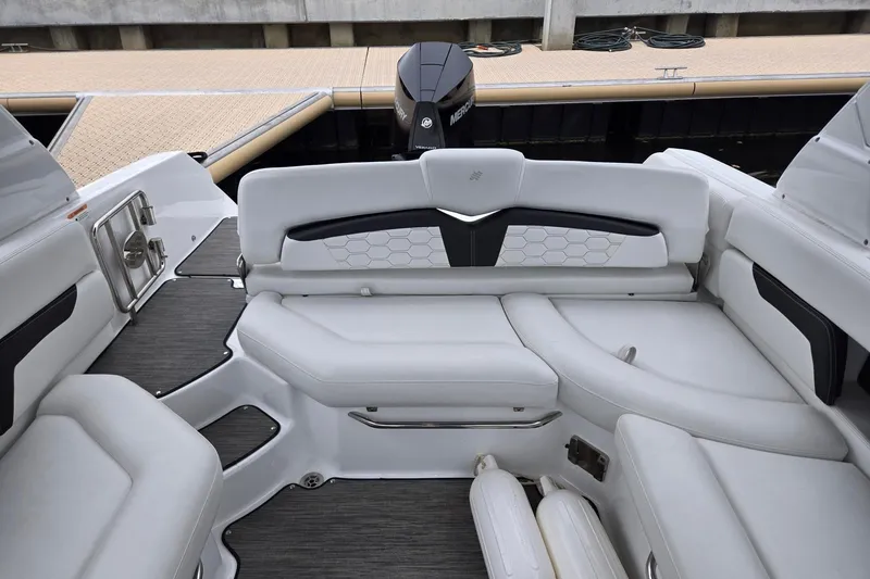 Slide: The Image of 2023 Four Winns HD5 OB boat interior with sleek white seating and modern design. - 5