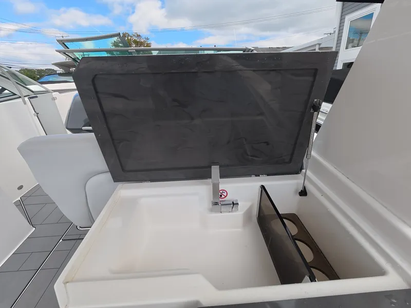 Slide: The Image of The 2021 Aviara AV32 OB features an open sink with a faucet and storage underneath. - 13