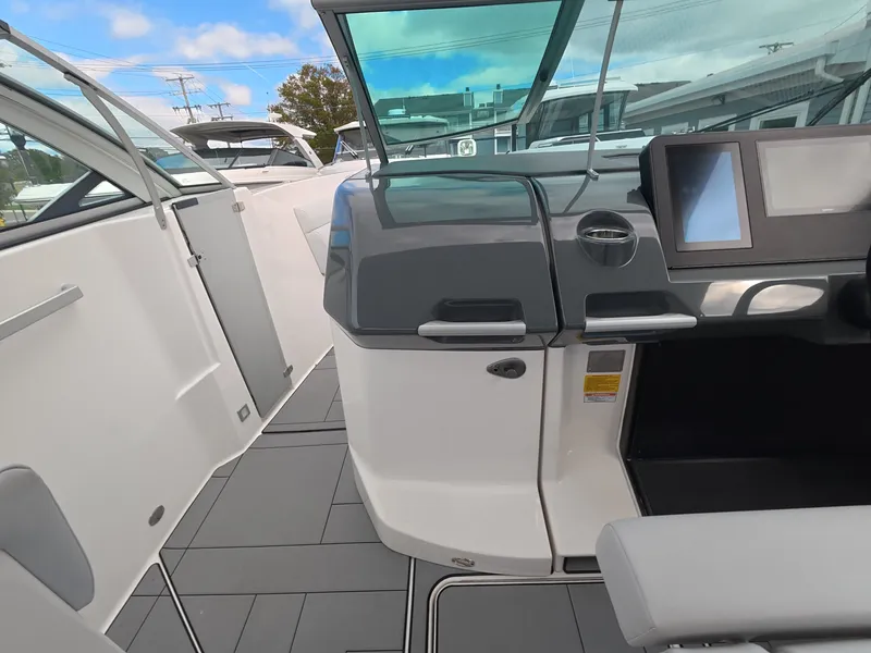 Slide: The Image of The image shows the cockpit of a 2021 Aviara AV32 OB with modern instruments and gray accents. - 17