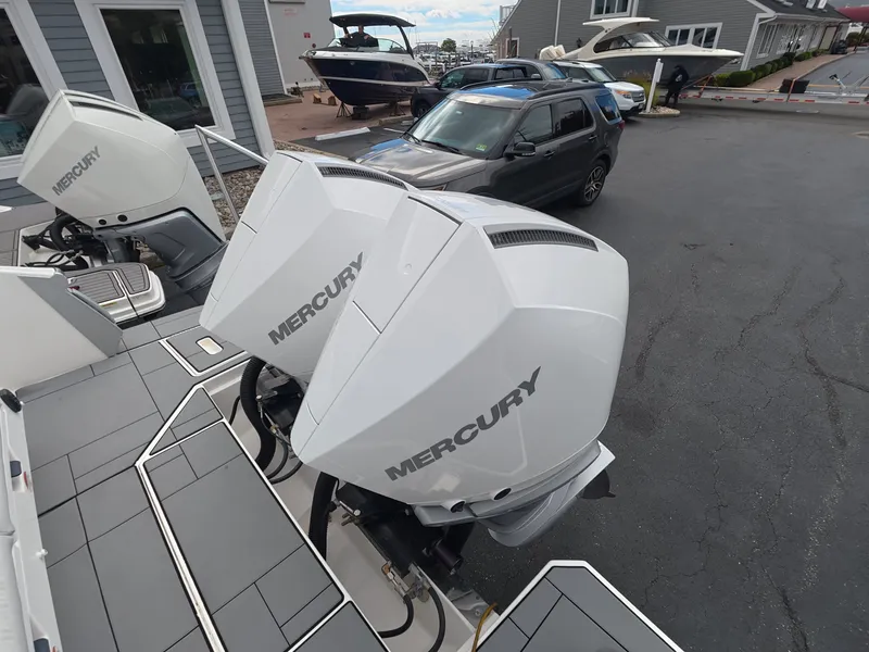 Slide: The Image of Two Mercury outboard engines are mounted on the stern of an Aviara AV32 OB boat. - 3