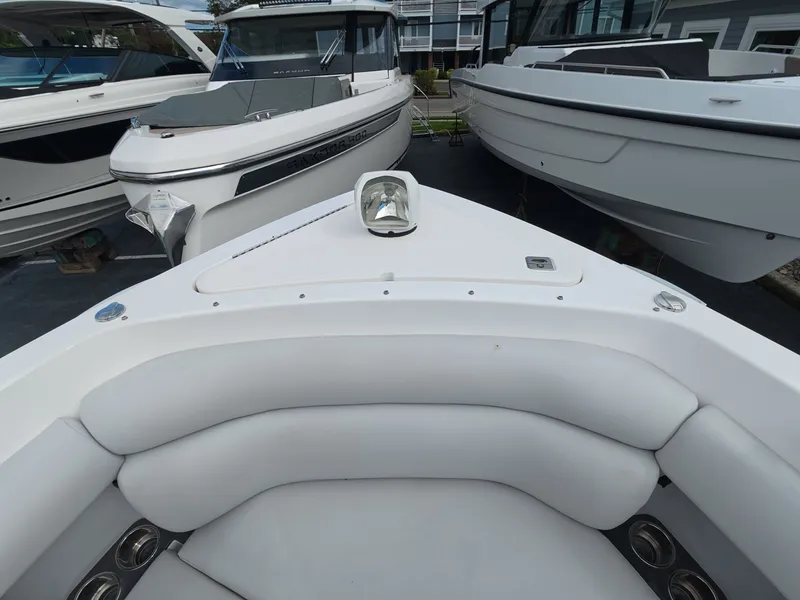 Slide: The Image of The image shows the bow of a 2021 Aviara AV32 OB with cushioned seating areas. - 24