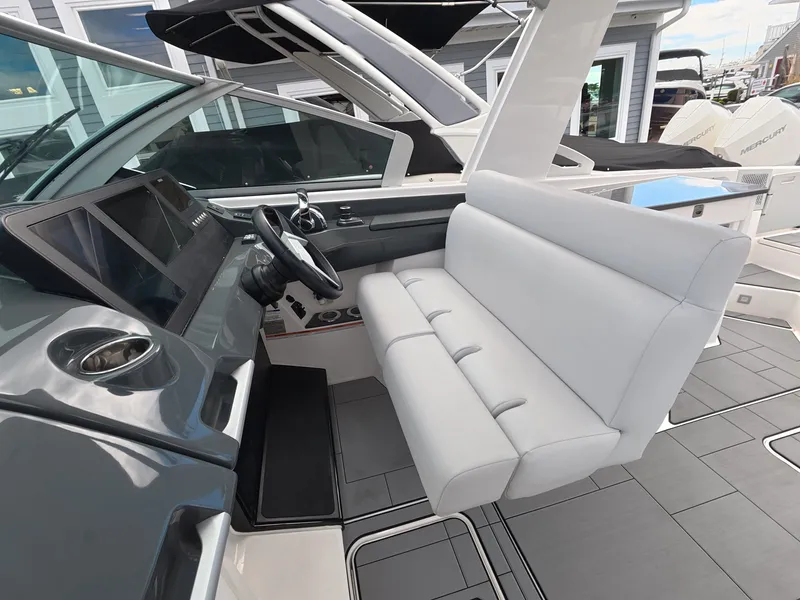 Slide: The Image of The image shows the cockpit of a 2021 Aviara AV32 OB with a sleek white seat. - 21