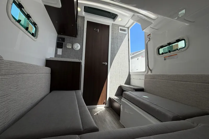 Slide: The Image of Interior of 2026 Everglades 395 Center Console boat, featuring modern seating and sleek design. - 102