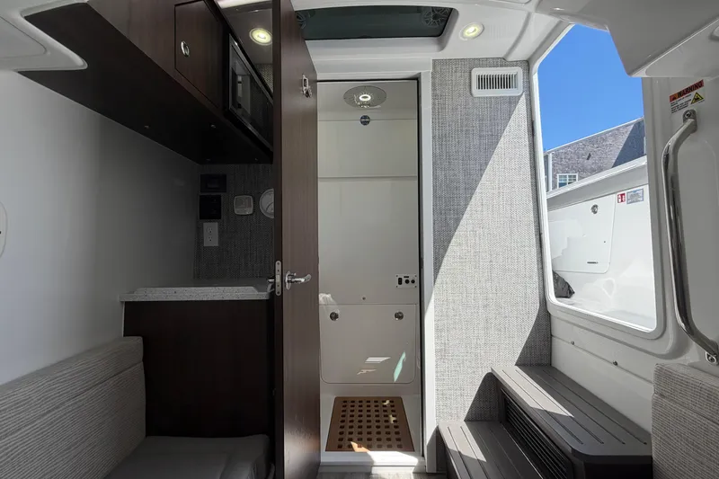 Slide: The Image of Interior of 2026 Everglades 395 Center Console boat, featuring modern amenities and sleek design. - 106