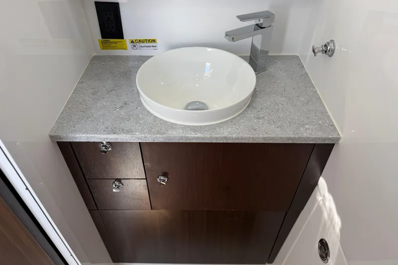 Slide: The Image of Modern bathroom vanity with vessel sink in 2026 Everglades 395 Center Console boat. - 112