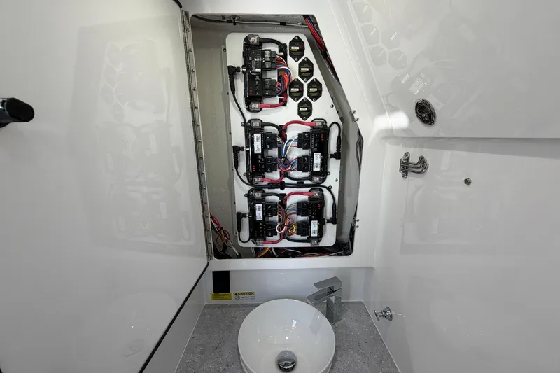 Slide: The Image of Electrical panel inside 2026 Everglades 395 Center Console boat, showcasing wiring and components. - 113