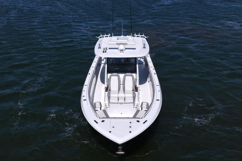Slide: The Image of 2026 Everglades 395 Center Console boat on open water, aerial view. - 13