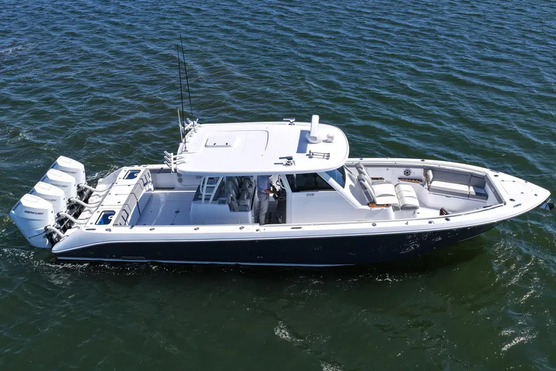 Slide: The Image of 2026 Everglades 395 Center Console boat cruising on open water. - 16