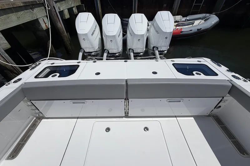 Slide: The Image of 2026 Everglades 395 Center Console boat with four powerful outboard engines. - 21