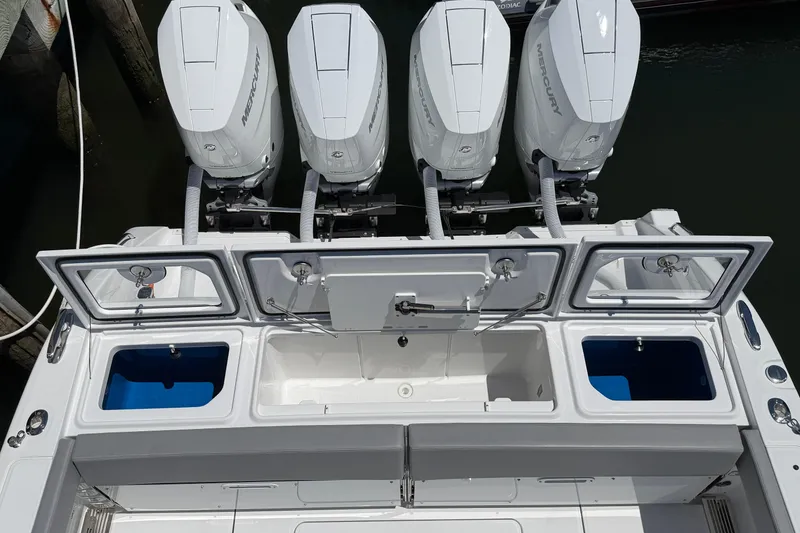 Slide: The Image of Four powerful Mercury outboard engines on a 2026 Everglades 395 Center Console boat. - 22
