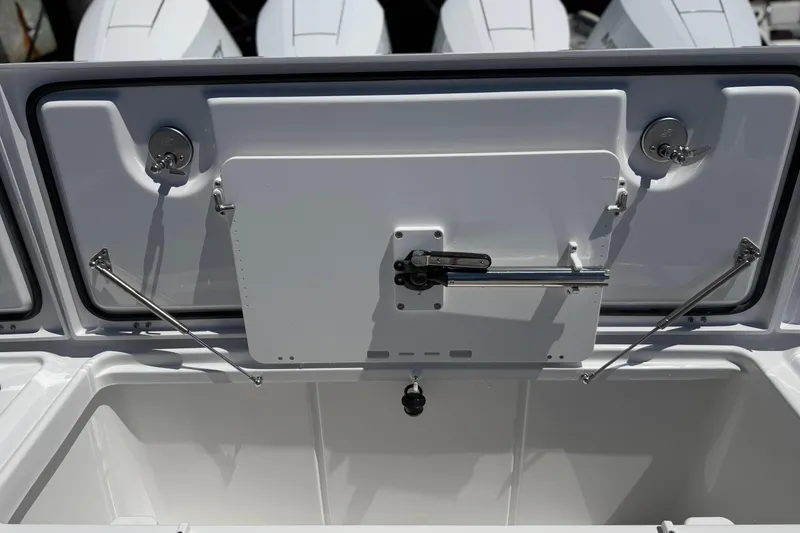 Slide: The Image of Open storage compartment on 2026 Everglades 395 Center Console boat, showcasing interior details. - 23