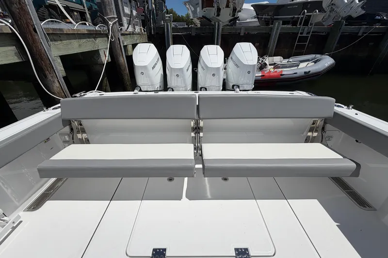 Slide: The Image of 2026 Everglades 395 Center Console boat with quad Mercury engines at dock. - 25