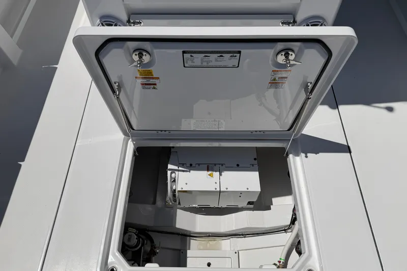 Slide: The Image of Open hatch of 2026 Everglades 395 Center Console boat, revealing internal components. - 26