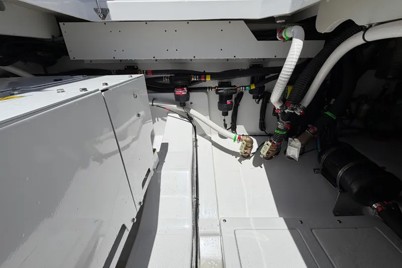 Slide: The Image of Engine compartment of 2026 Everglades 395 Center Console boat, showcasing mechanical components. - 29